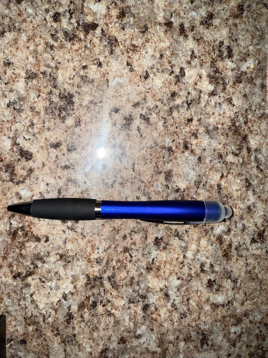 Black 3-in-1 stylus pen with custom engraved logo, featuring a ballpoint tip, LED light, and touchscreen stylus – perfect for business promotions and personalized gifts