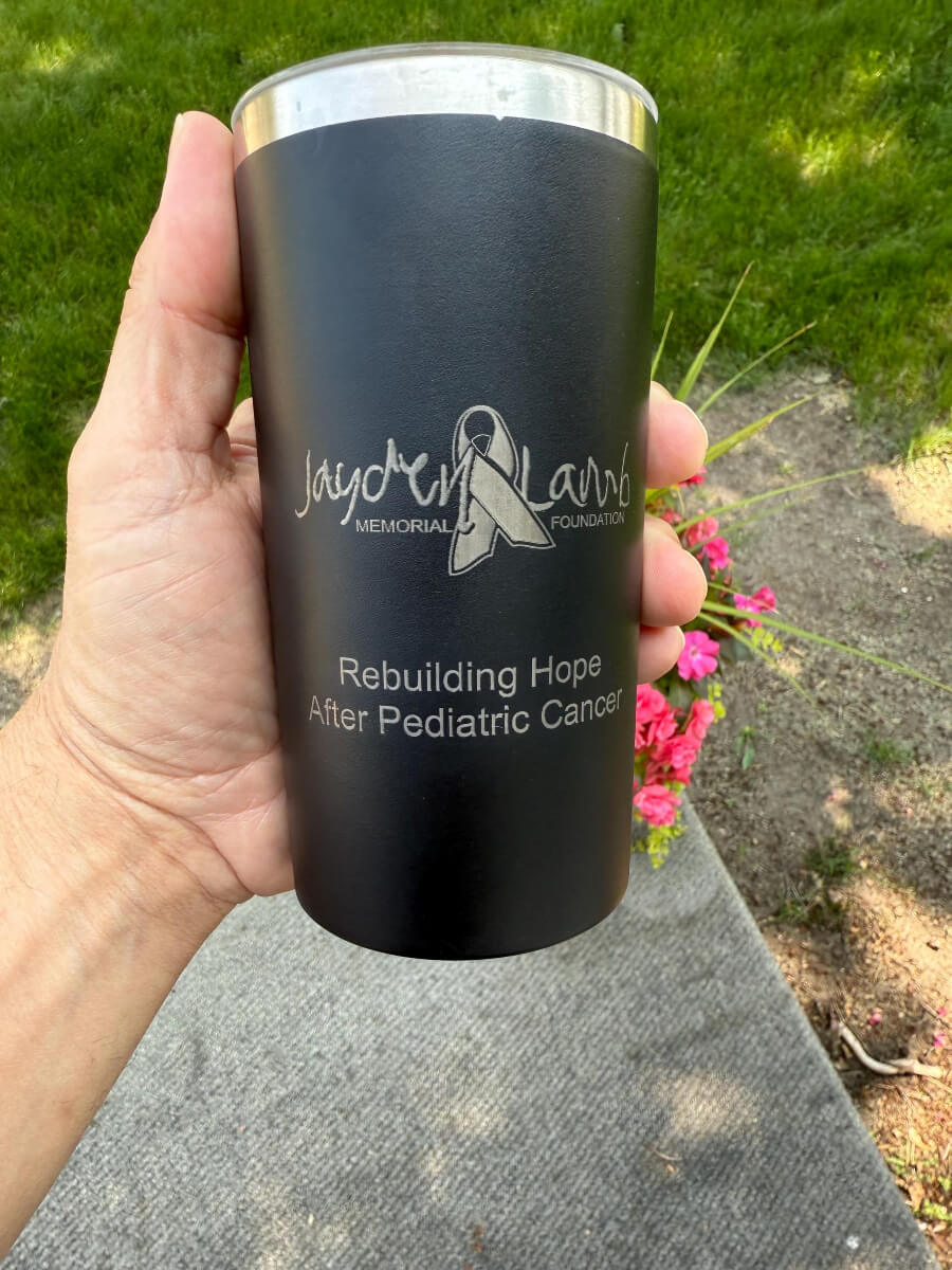 Engraved black 12oz tumbler with Jayden Lamb Memorial Foundation logo and rebuilding hope after pediatric cancer message