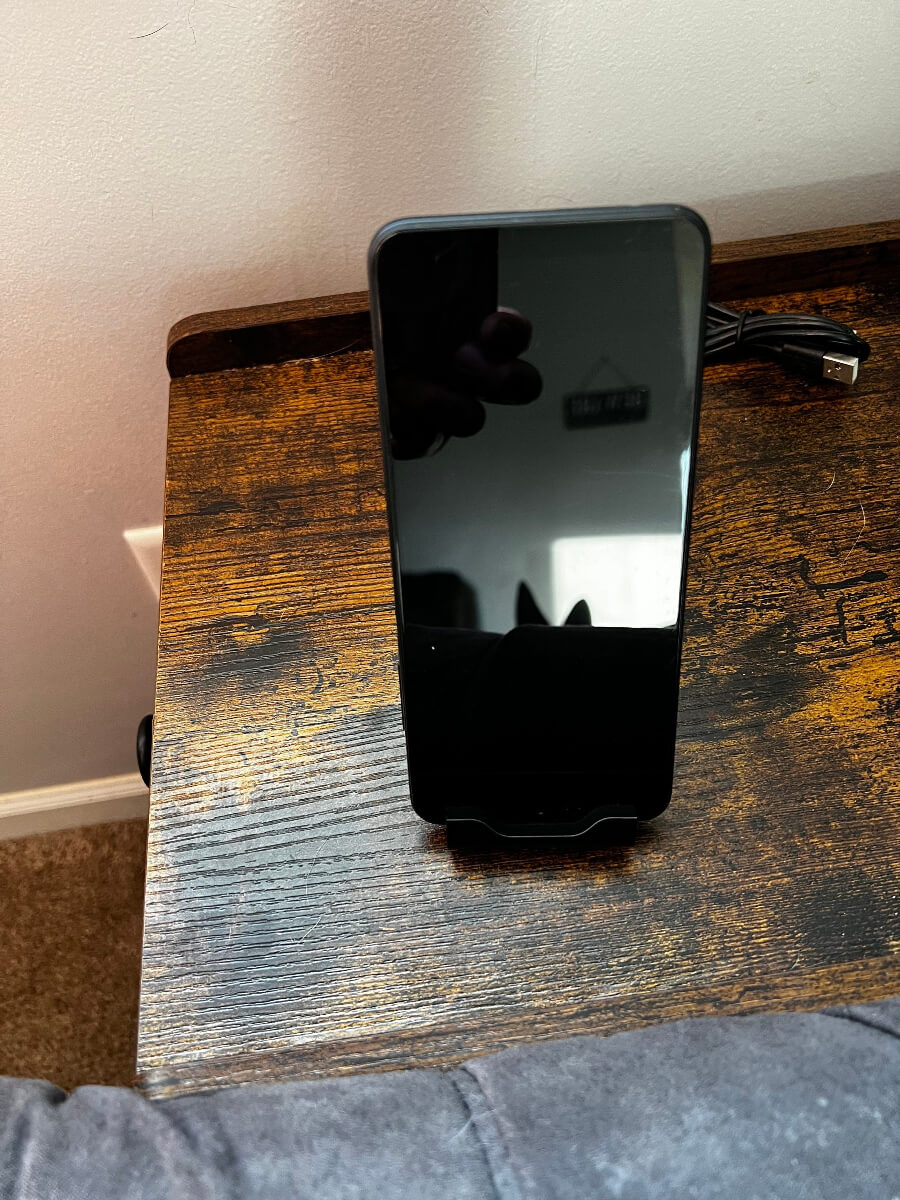 phone sitting in phone stand actual product 