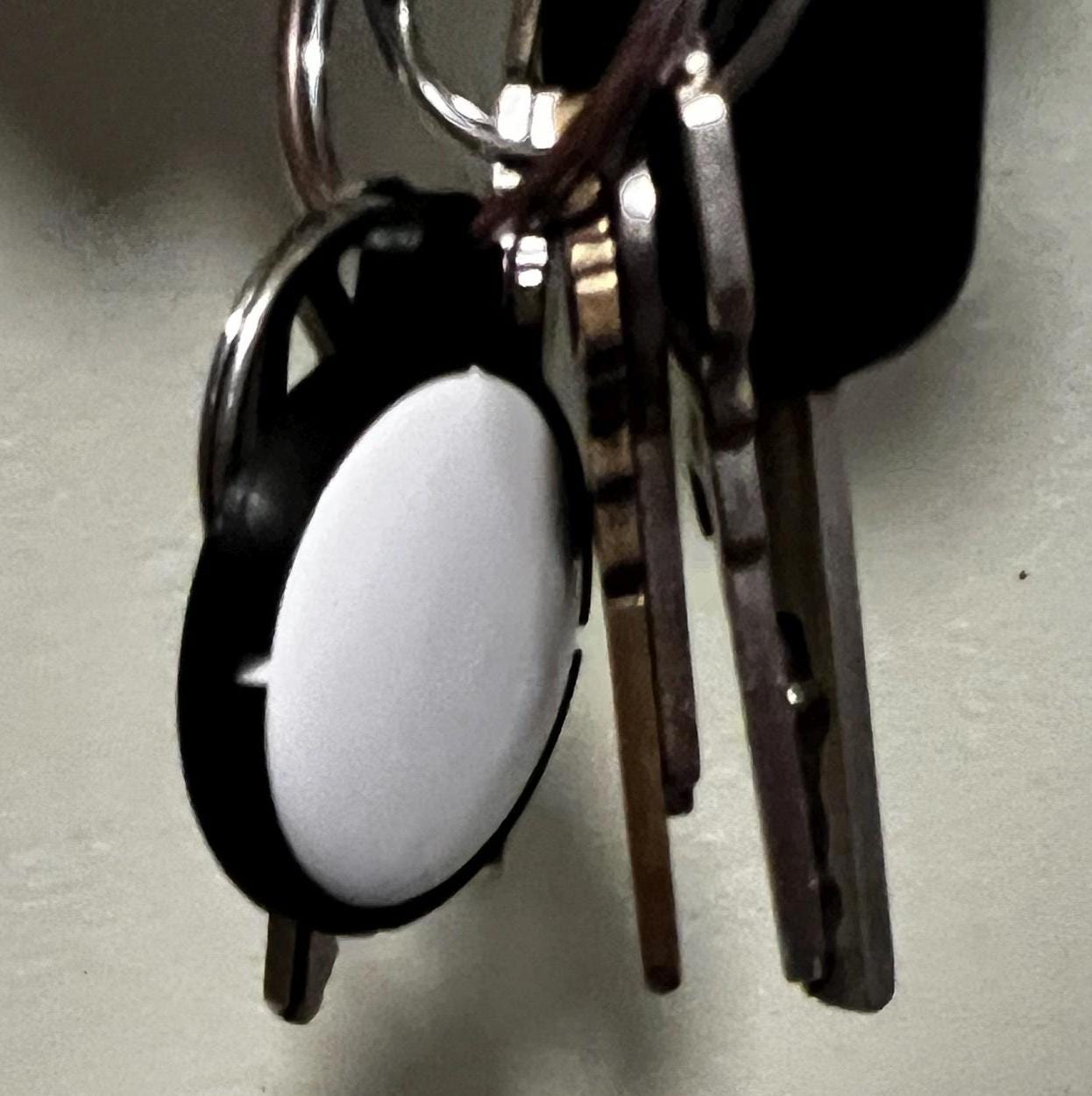 Custom AirTag keychain holder attached to keys – Apple tracker accessory for everyday use