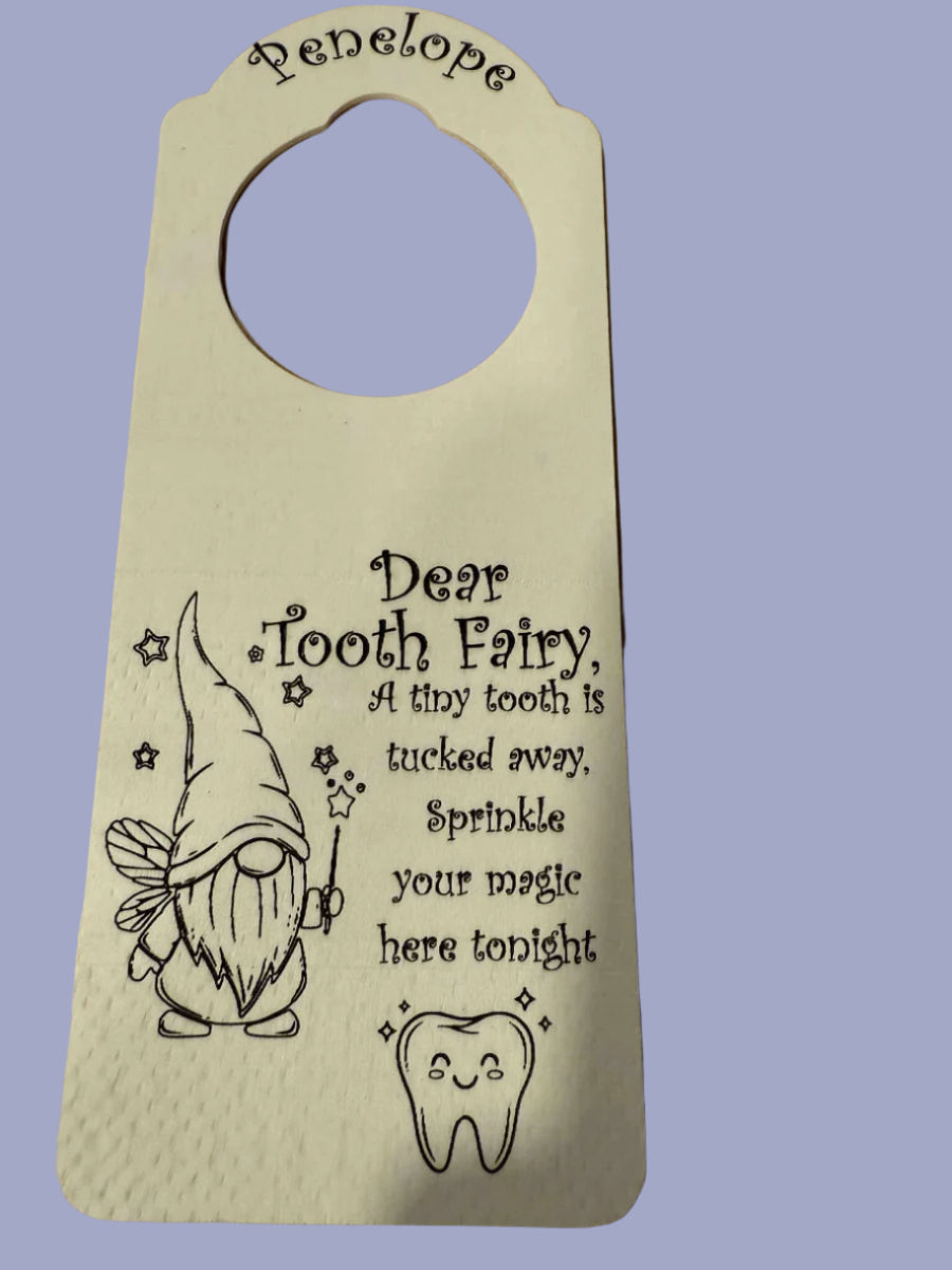 Personalized wooden tooth fairy door hanger with the name Penelope, engraved gnome fairy and smiling tooth design, message for the tooth fairy.